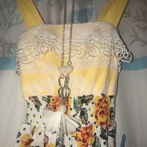 Kids yellow romper with floral design; 4-5t